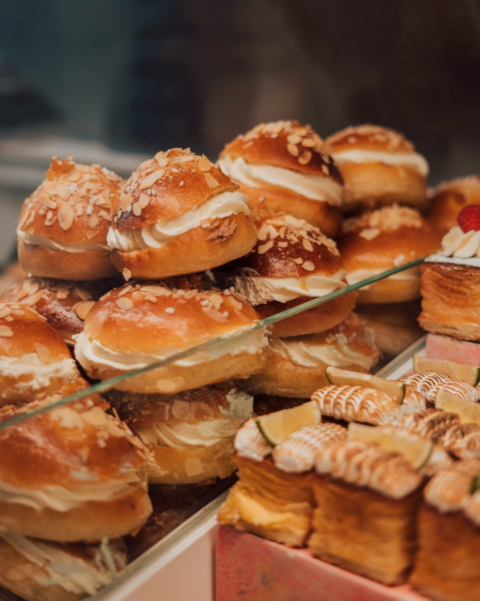 Rows of filled barms wrapped in paper, ready for the morning rush.